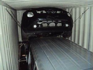 Shipping vehicles by container